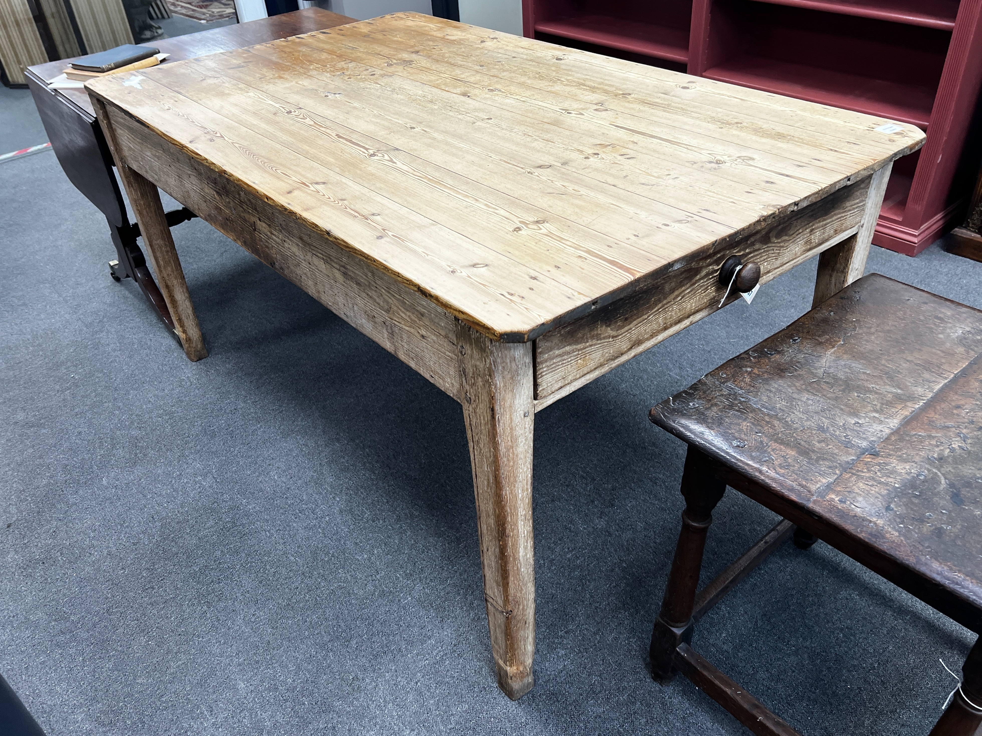 A Victorian rectangular pine kitchen table with planked top and single frieze drawer, length 162cm, width 97cm, height 81cm